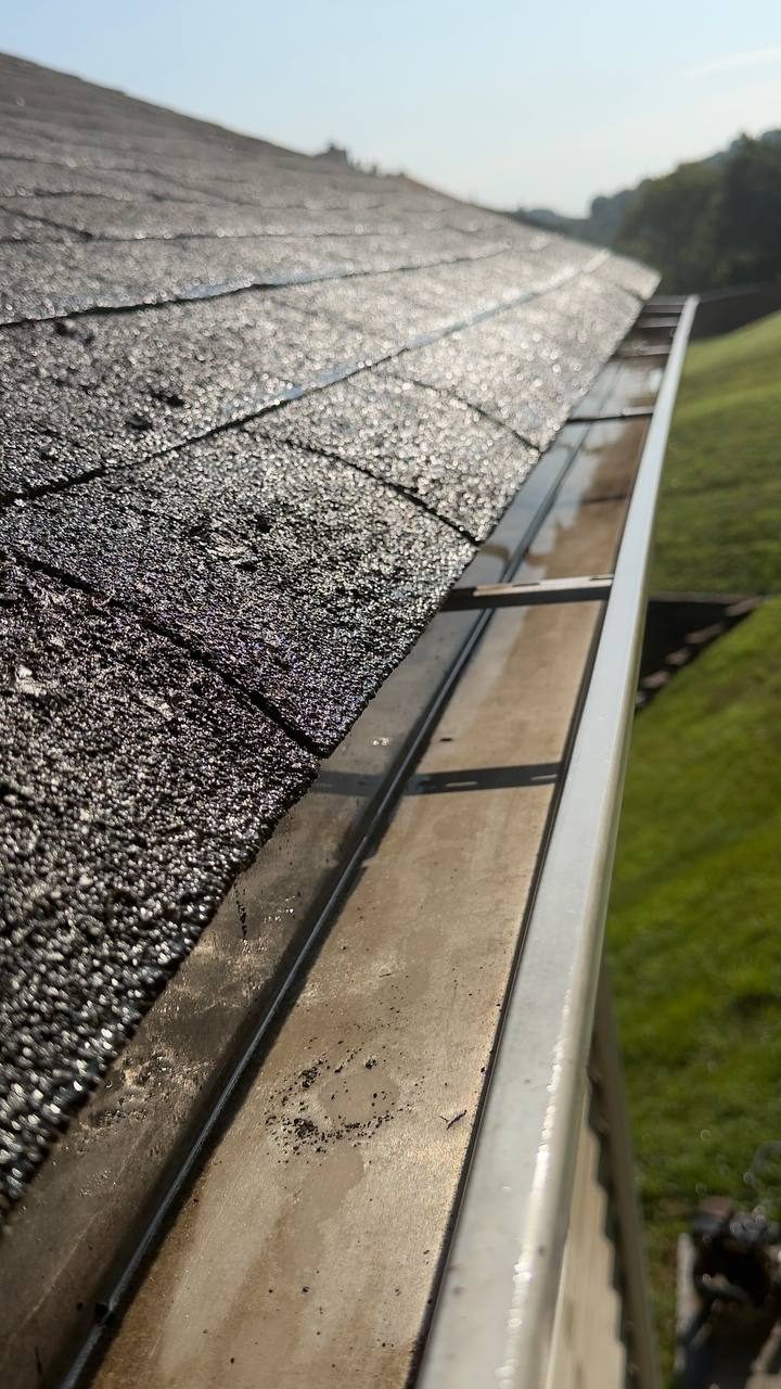 Same gutter run, cleaned and flowing
